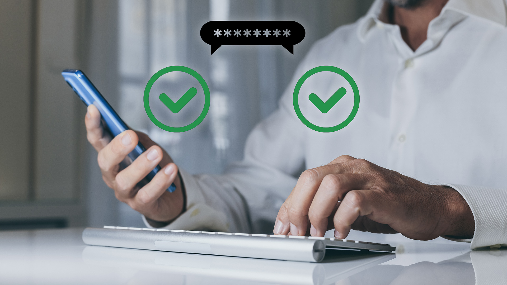 Hands using a phone and keyboard with a password bubble and two green check marks—two-factor authentication login.